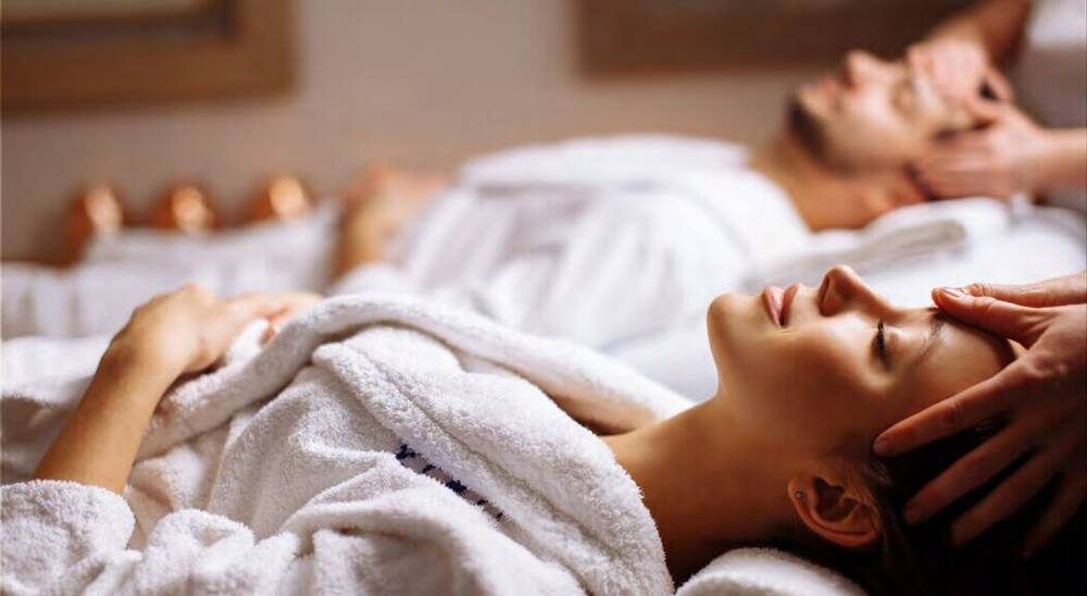 Couple receiving spa treatment, Vihangam